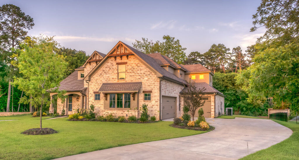 home sitting on a well manicured landscape