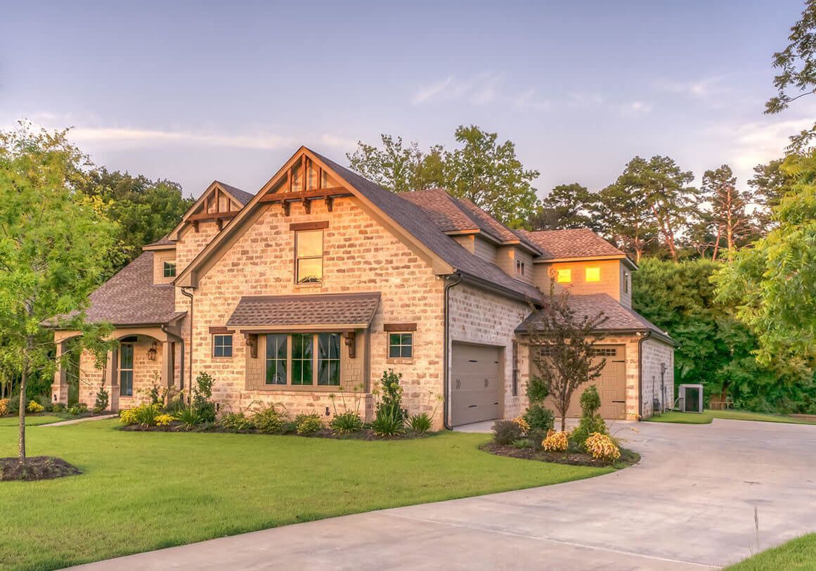 home sitting on a well manicured landscape