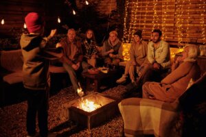 family gathered around a fire pit