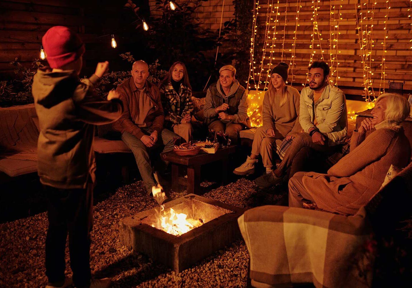 family gathered around a fire pit